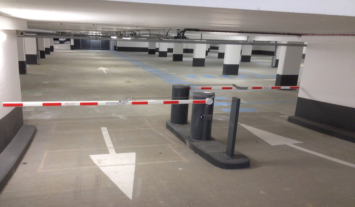 What are the benefits of installing parking barriers for businesses