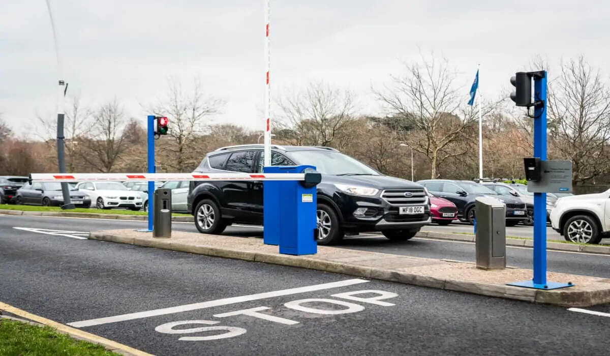 What are the benefits of installing parking barriers for businesses